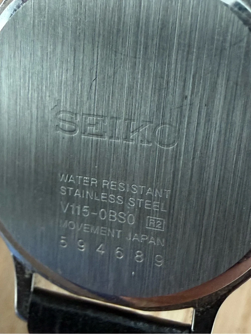 Seiko Solar Ladies Watch White Round Dial Black Leather Strap Stainless Case